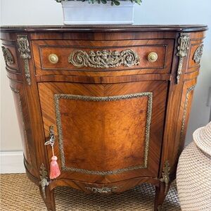 Elegant Brown Wooden Cabinet with Gold Accents